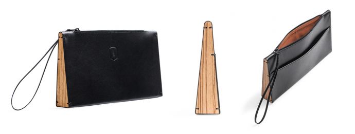 The black leather Apis Clutch bag with wooden detailing