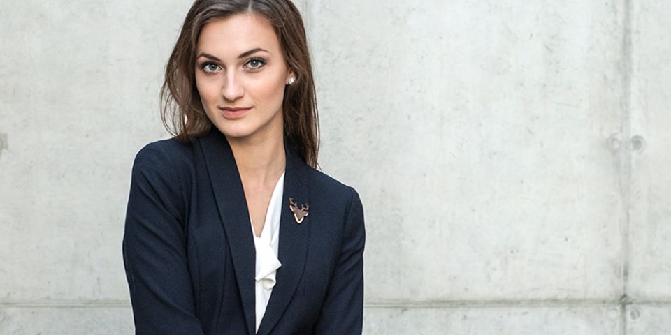 BeWooden - A woman in a jacket with the wooden brooch Deer Brooch