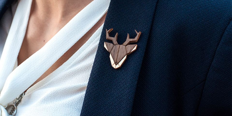 A woman in a jacket with the wooden brooch Deer Brooch A woman in a jacket with the wooden brooch Deer Brooch