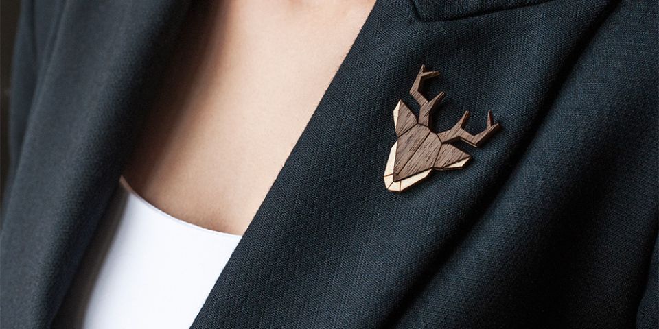 BeWooden - A woman in a jacket with the wooden brooch Deer Brooch
