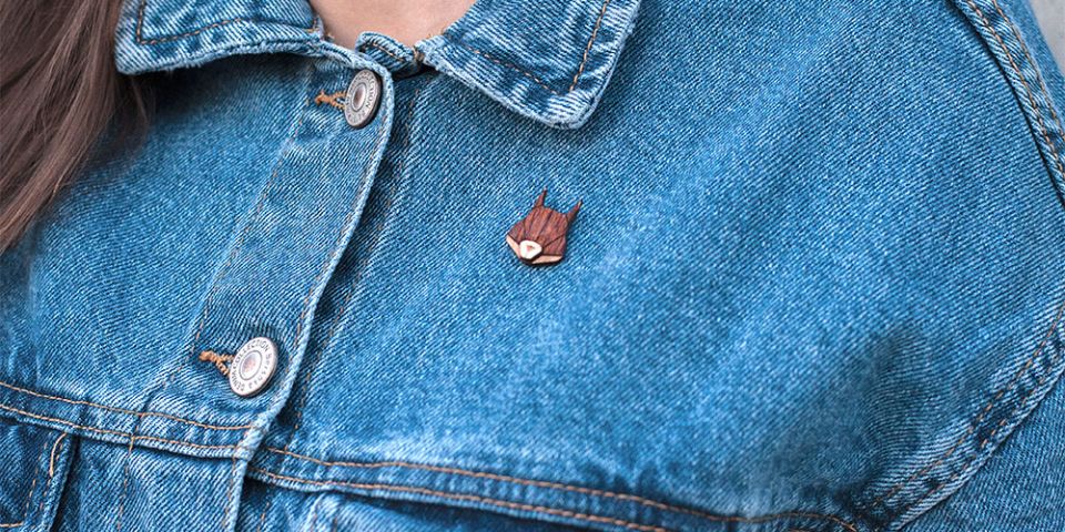 BeWooden - A woman in jeans jacket with the wooden brooch Squirrel Brooch
