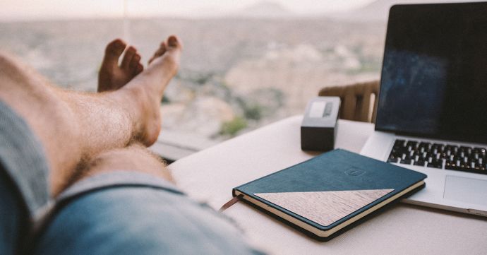 A man at the table with the BeWooden Ocean Notebook