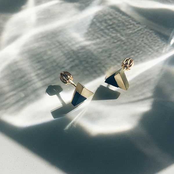 A silver jewellery with wooden details