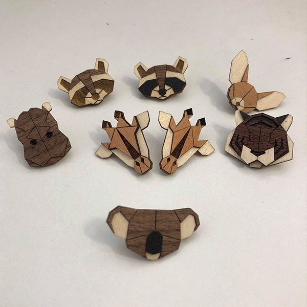 Wooden brooches with animal motifs