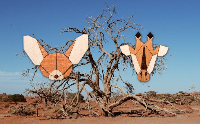 The giraffes and desert fox wood brooch in the landscape of Africa