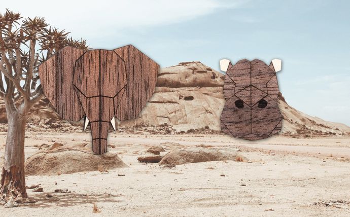 The elephants and hippo wooden brooches in the landscape of Africa